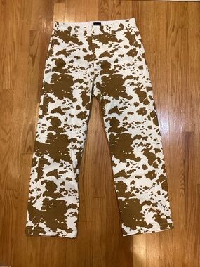 White and brown cow print pants